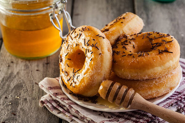Morning breakfast with donuts and honey